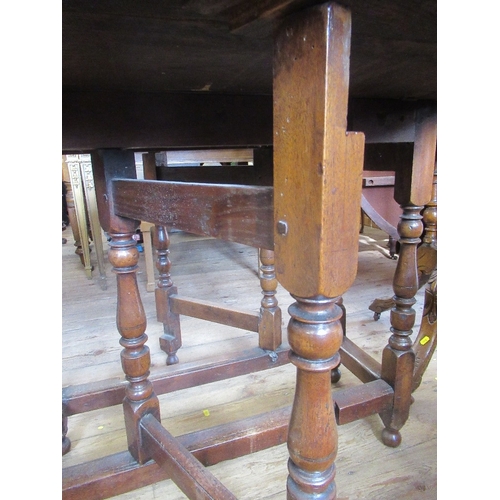 46 - An Antique oak gate leg table, width 33ins