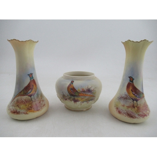 461 - A pair of Locke & Co Worcester blush ivory vases, decorated with pheasants by W Stinton, height 5.75... 