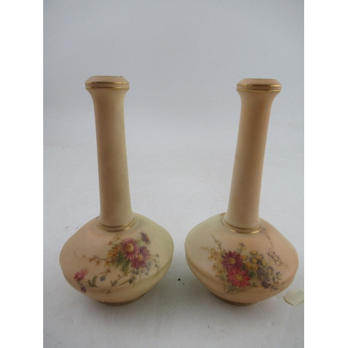 465 - A pair of Royal Worcester blush ivory vases, decorated with flowers, shape number 1531, height 7ins