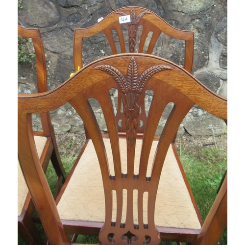 54A - A collection of dining chairs, including four single dining chairs, decorated with a wheatsheaf