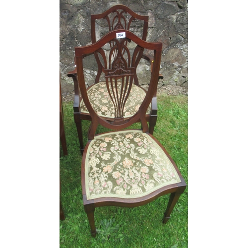 54A - A collection of dining chairs, including four single dining chairs, decorated with a wheatsheaf