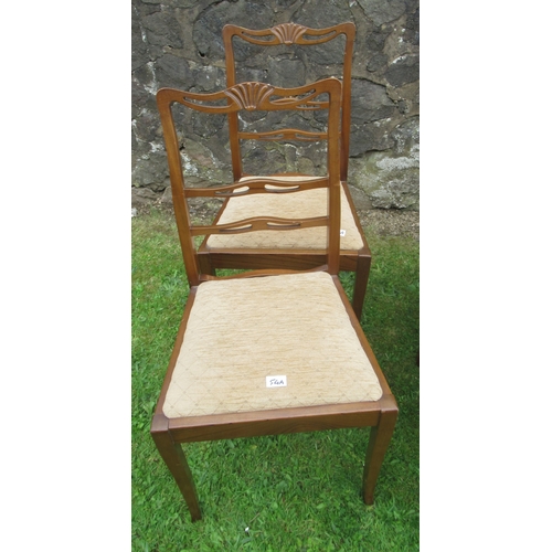 54A - A collection of dining chairs, including four single dining chairs, decorated with a wheatsheaf