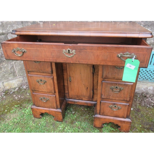 56 - An 18th century walnut kneehole desk, width 34ins, depth 20ins, height 32ins