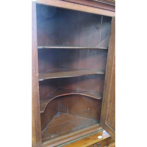 60 - A Georgian oak corner cupboard, width 34ins