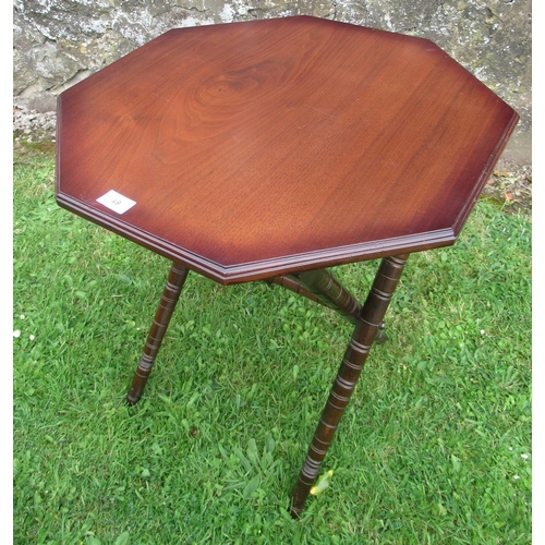 61 - A folding mahogany table, width 22ins