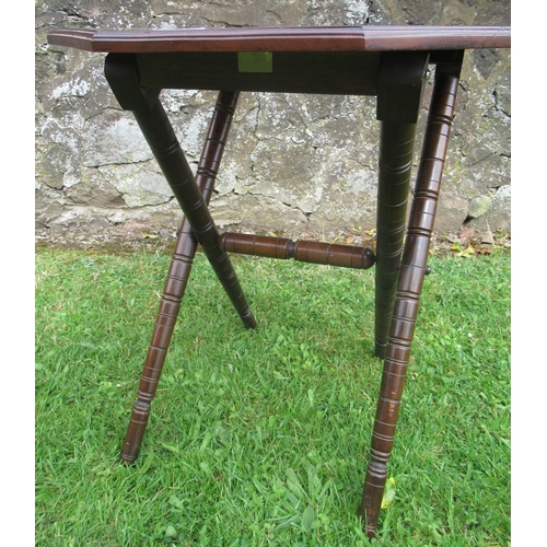 61 - A folding mahogany table, width 22ins