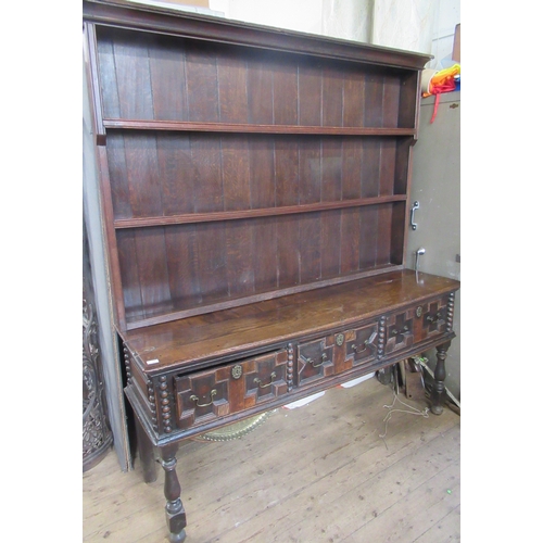 68 - An Antique oak dresser, with boarded plate rack over, the base having moulded drawer fronts, width 7... 