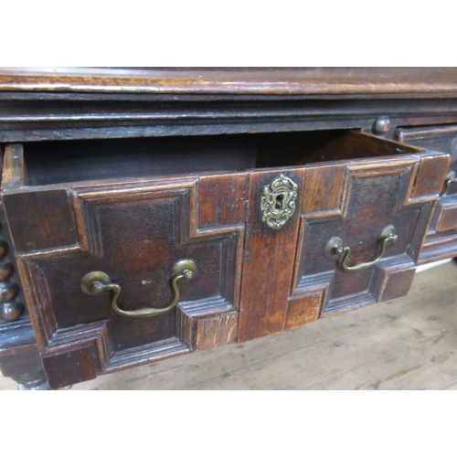 68 - An Antique oak dresser, with boarded plate rack over, the base having moulded drawer fronts, width 7... 