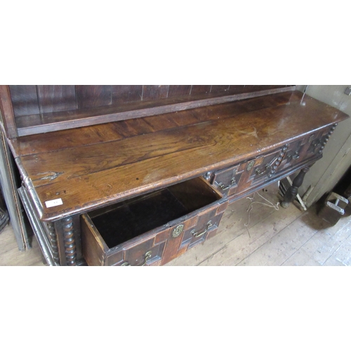 68 - An Antique oak dresser, with boarded plate rack over, the base having moulded drawer fronts, width 7... 