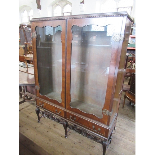 69 - A walnut display cabinet on stand,  with glass shelves, width 52ins, height 69ins