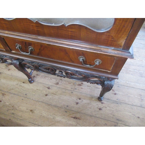 69 - A walnut display cabinet on stand,  with glass shelves, width 52ins, height 69ins