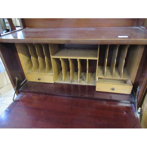 70 - An Edwardian narrow bureau, with cross banded decoration, the drop flap revealing drawers and pigeon... 