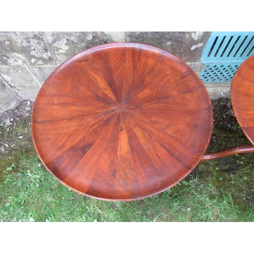 73 - A pair of circular occasional tables, with geometric veneer decoration, raised on tripod bases, diam... 