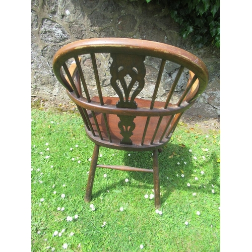 75 - A Windsor armchair, with pierced splat