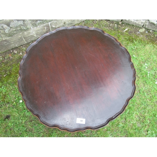 80 - A revolving circular table/book stand, with pie crust top