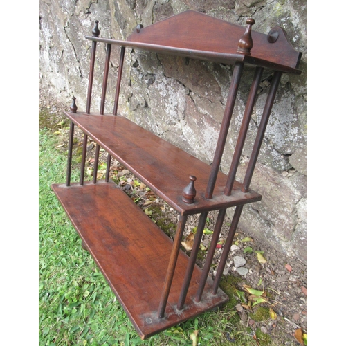 81 - A 19th century mahogany set of open shelves, width