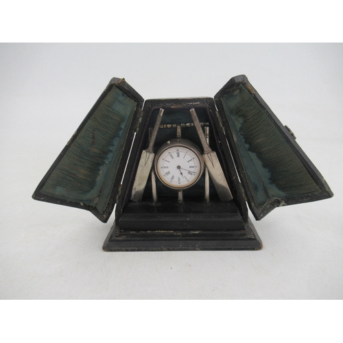 225 - A novelty silver plated desk clock, formed as a cricket ball, stumps, bails and bats, on plinth base... 