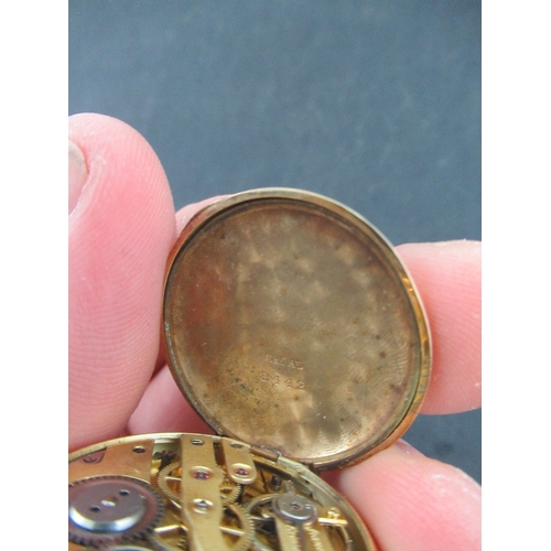 311a - A 14K yellow gold fob watch , stamped '8442', engraved , monogram to reverse, weight 24g