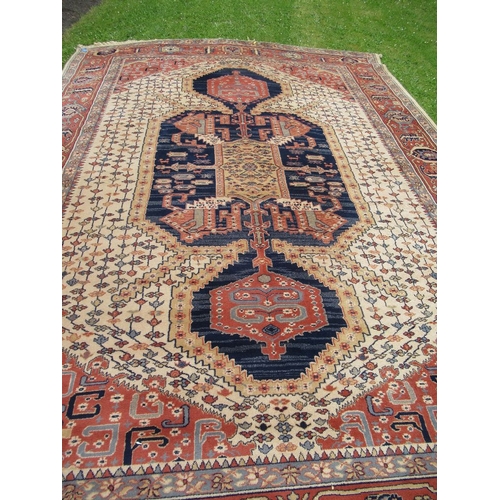 86 - A large Super Keshan rug, made in Belgium, with geometric design to a red and cream ground, 162ins x... 