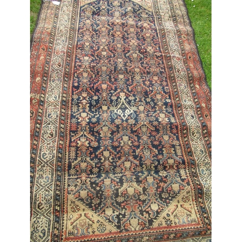 91 - An Eastern design rug,  84ins x 48ins