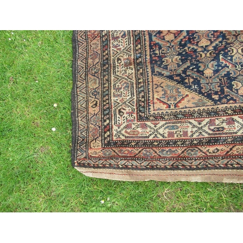 91 - An Eastern design rug,  84ins x 48ins