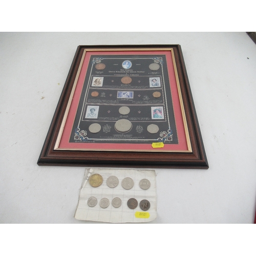 169 - A framed collection of coins and stamps commemorating Queen Elizabeth the Queen Mother, together wit... 