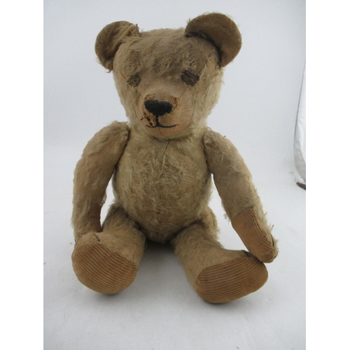 163 - An early to mid 20th century plush jointed teddy bear, with growler (not working)