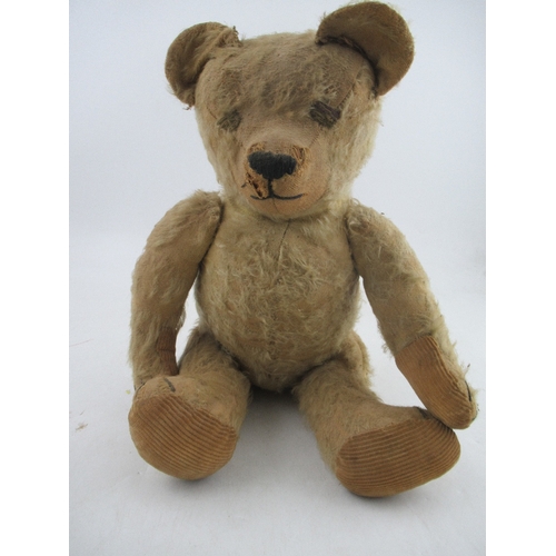 163 - An early to mid 20th century plush jointed teddy bear, with growler (not working)