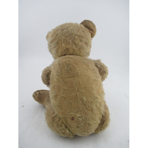 163 - An early to mid 20th century plush jointed teddy bear, with growler (not working)