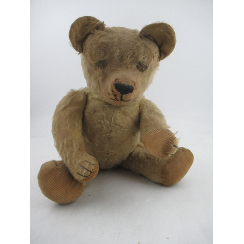 163 - An early to mid 20th century plush jointed teddy bear, with growler (not working)