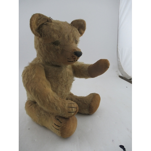 163 - An early to mid 20th century plush jointed teddy bear, with growler (not working)