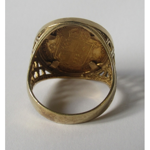 321a - A 9ct ring set with a Victorian shield back half sovereign, dated 1892, with pierced shoulders, weig... 