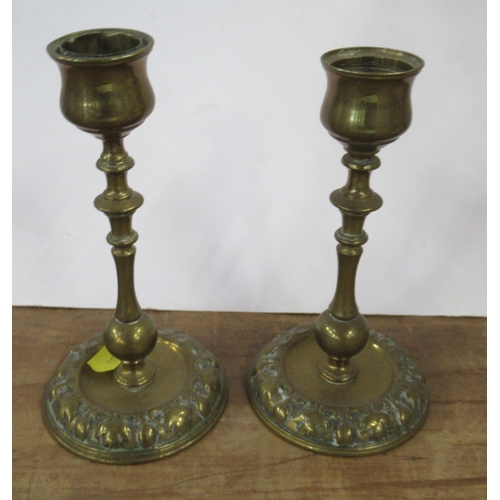 119 - A pair of brass candlesticks, height 5ins