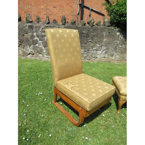 12 - An Art Deco style easy chair and a foot stool, upholstered in the same fabric