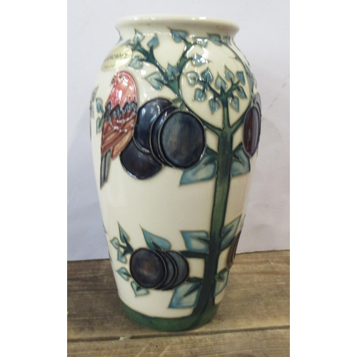 126 - A Moorcroft vase, decorated in the Plum Tree pattern, height 7.5ins