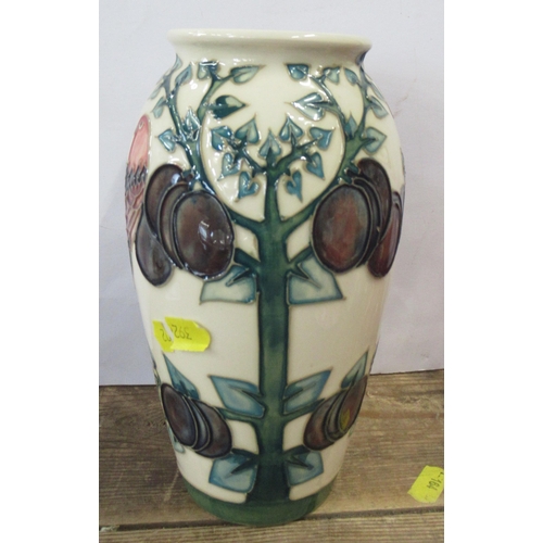 126 - A Moorcroft vase, decorated in the Plum Tree pattern, height 7.5ins