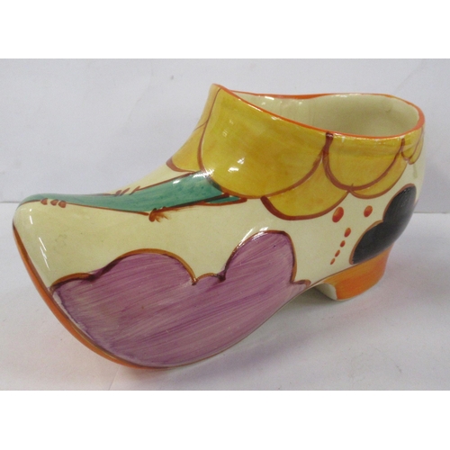 135 - A Clarice Cliff clog, decorated in the Summerhouse pattern, height 3.5ins