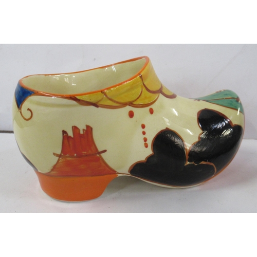 135 - A Clarice Cliff clog, decorated in the Summerhouse pattern, height 3.5ins