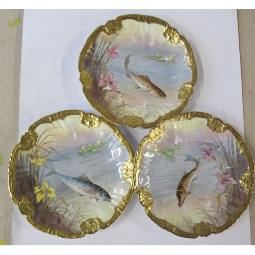 147 - Three Limoges plates, all decorated with fish swimming and flowers by Francis, diameter 9.5ins