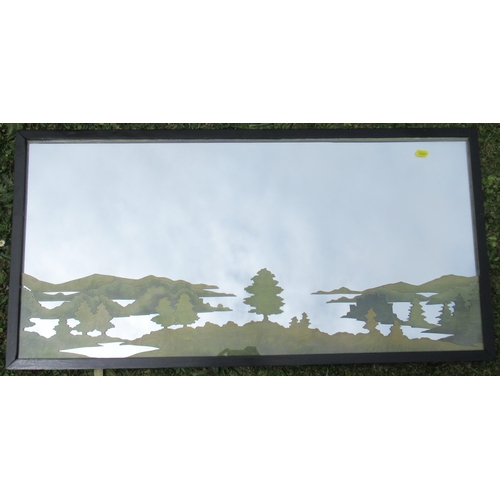 181 - A rectangular wall mirror, with green forest decoration, 17ins x 36ins