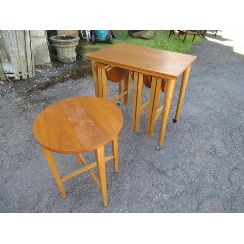 21 - A nest of mid century folding tables