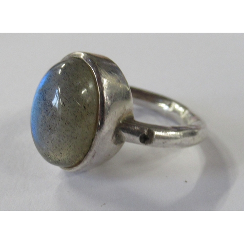 211 - A silver coloured stacking ring, in two sections, together with a stone set ring