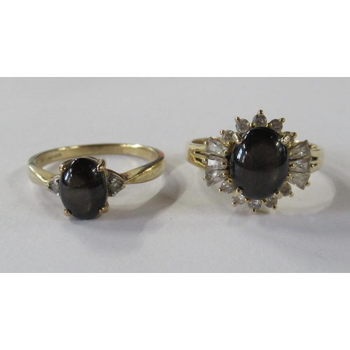 212 - A 9ct gold ring, set with a diopside star sapphire, together with another similar ring