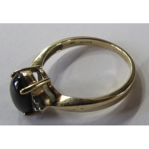 212 - A 9ct gold ring, set with a diopside star sapphire, together with another similar ring