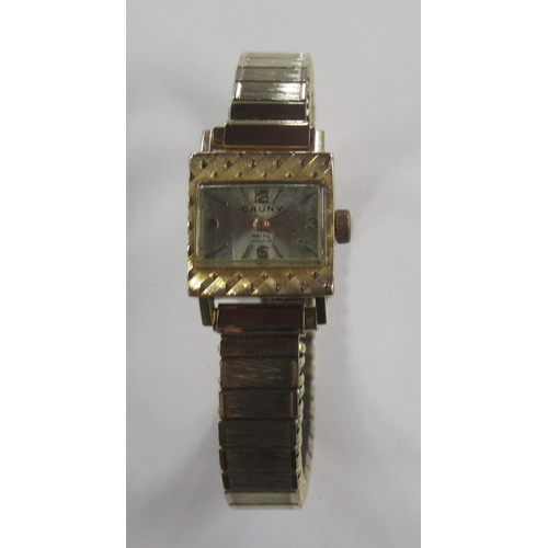 214 - Cauny, an 18K cased wrist watch with expanding bracelet