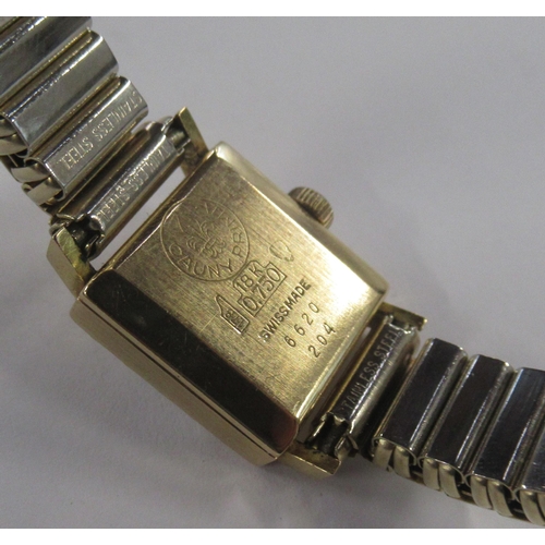 214 - Cauny, an 18K cased wrist watch with expanding bracelet