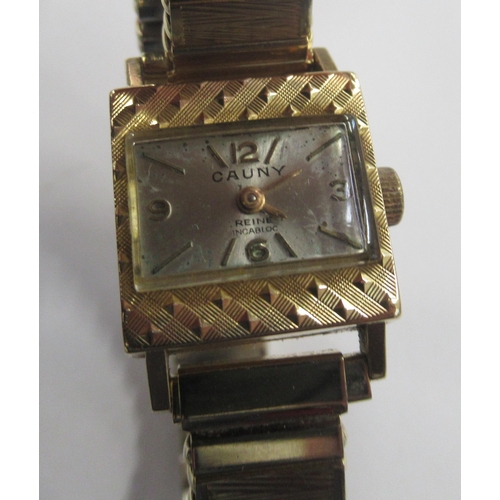 214 - Cauny, an 18K cased wrist watch with expanding bracelet