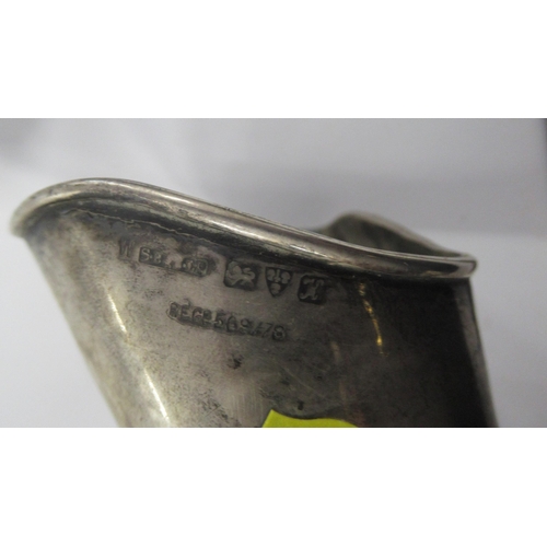 218 - A silver snuffer, af, a Sheffield plate snuffer, and two other items