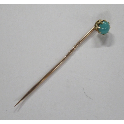 225 - A gold stick pin, set with a turquoise