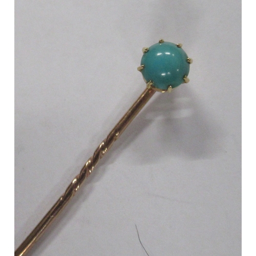 225 - A gold stick pin, set with a turquoise